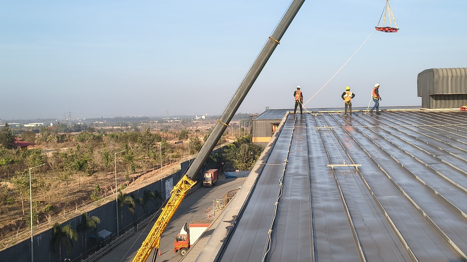 60-ton mobile crane executing ridge closing on a world-class facility